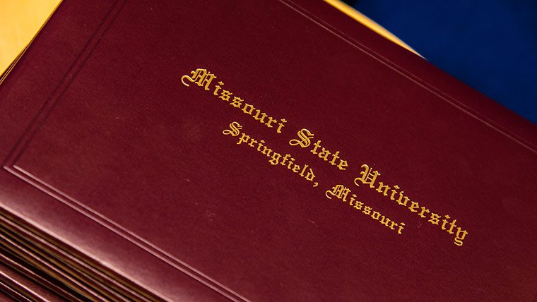 Cover of Missouri State University diplomas.