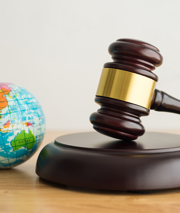 Earth globe with gavel