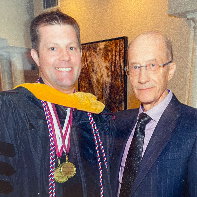 Gen. Rose (right) celebrates with excited graduate