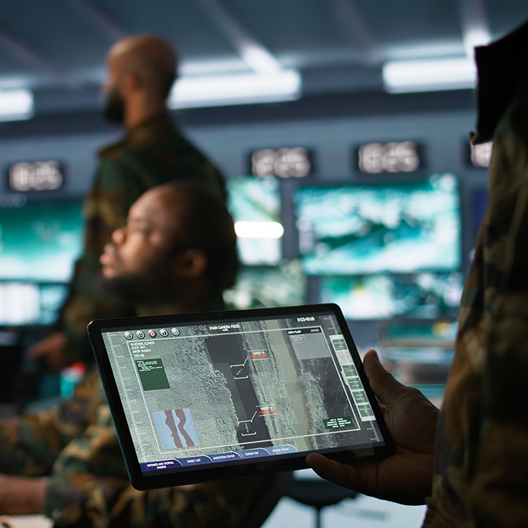 Men in tech-filled war room