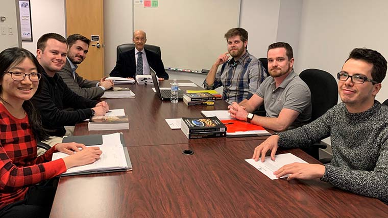 Students in class with defense and strategic studies department head John Rose. 