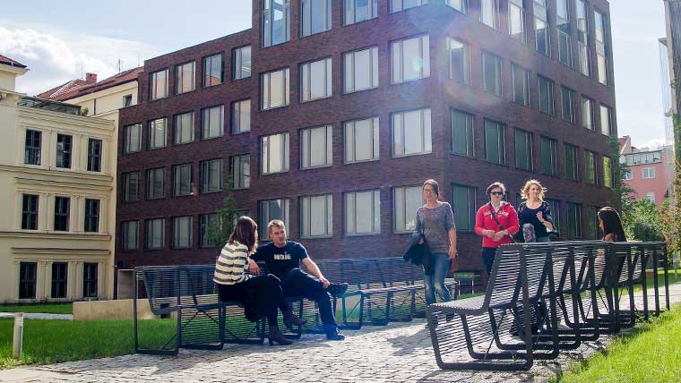 Students walking along Masaryk University campus in Czech Republic. 